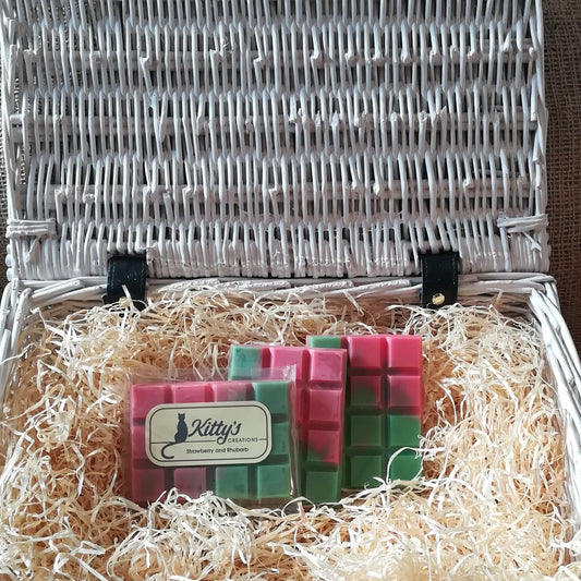 Three hand-made rectangular Wax Melts. Each is a coloured blend from green to pink mimicking how the balance of the fragrance is beautifully combined. Each melt is a nostalgic trip back to childhood fun, remember as you helped to harvest the strawberries and rhubarb in the summers that went on forever.